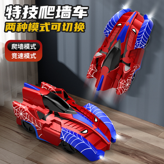 Red and blue toy cars with spider web design on a wooden floor against a gray wall.