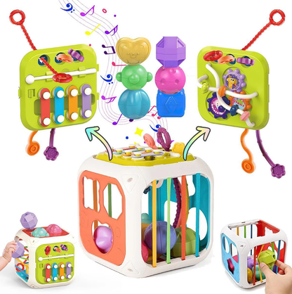 Colorful baby activity cube with various educational toys on a white background