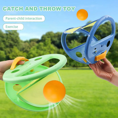 Two colorful 'Catch and Throw Toy' devices with orange balls on a grassy background.