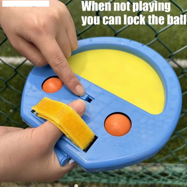 Toy device with a ball inside, resembling a classic video game controller, held by a hand.