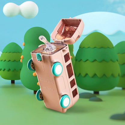 Toy suitcase with a baby bottle on wheels against a colorful landscape background