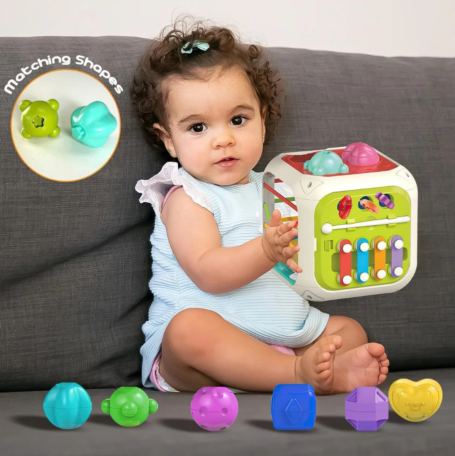Child playing with a colorful educational toy on a couch