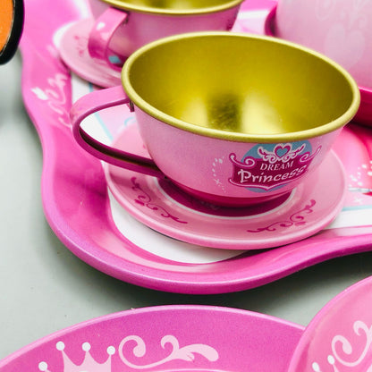 Pink and gold princess-themed tea set on a light gray background