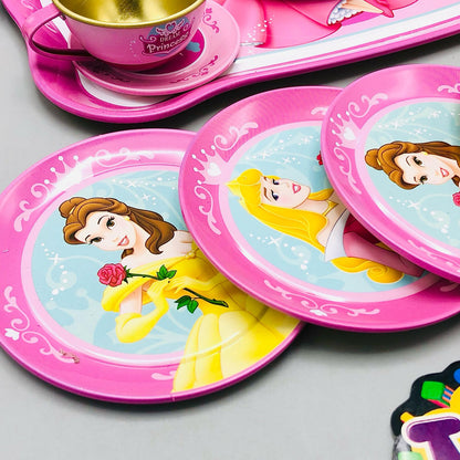 Set of Disney Princess-themed plates and a cup on a gray surface